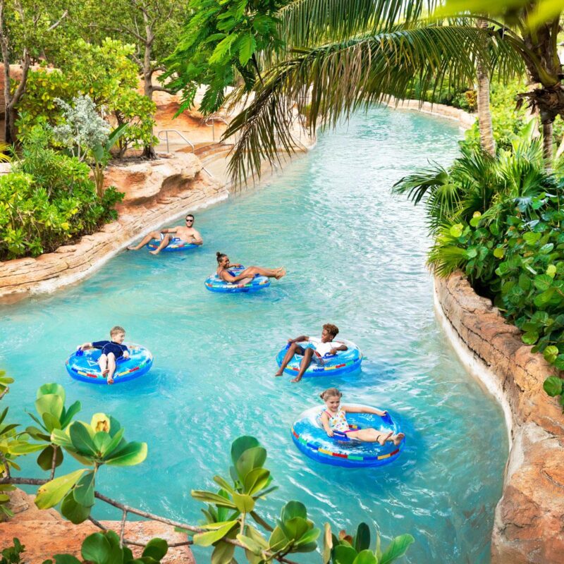 5 LazyRiverHotels Atlantis Aquaventure Rapids River Guests on Innertubes1