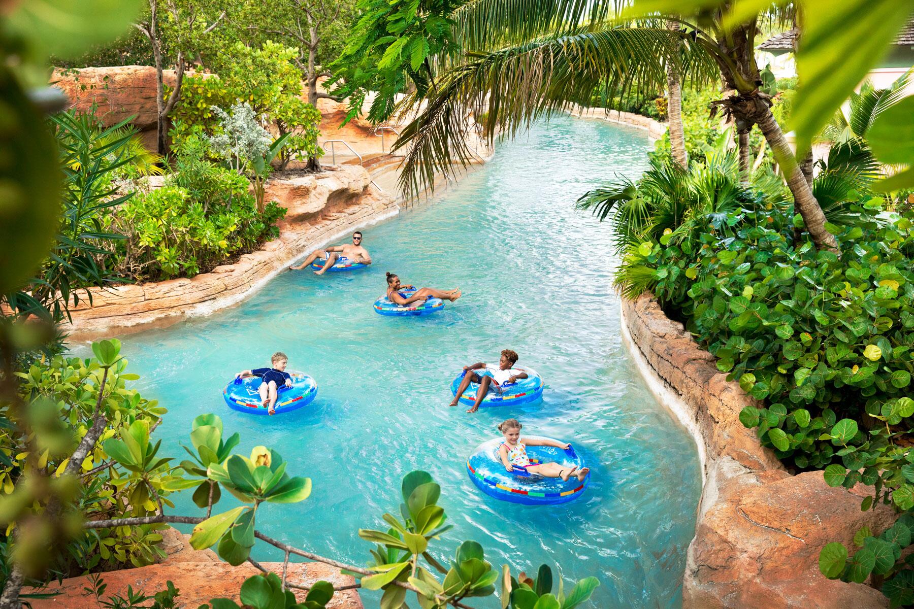 5 LazyRiverHotels Atlantis Aquaventure Rapids River Guests on Innertubes1